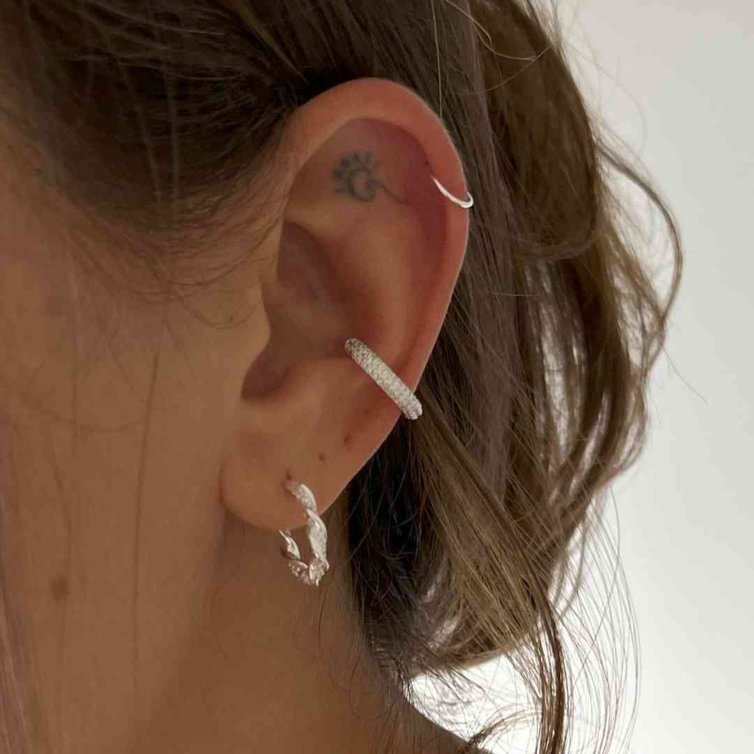 Piercing fake conch cravejado
