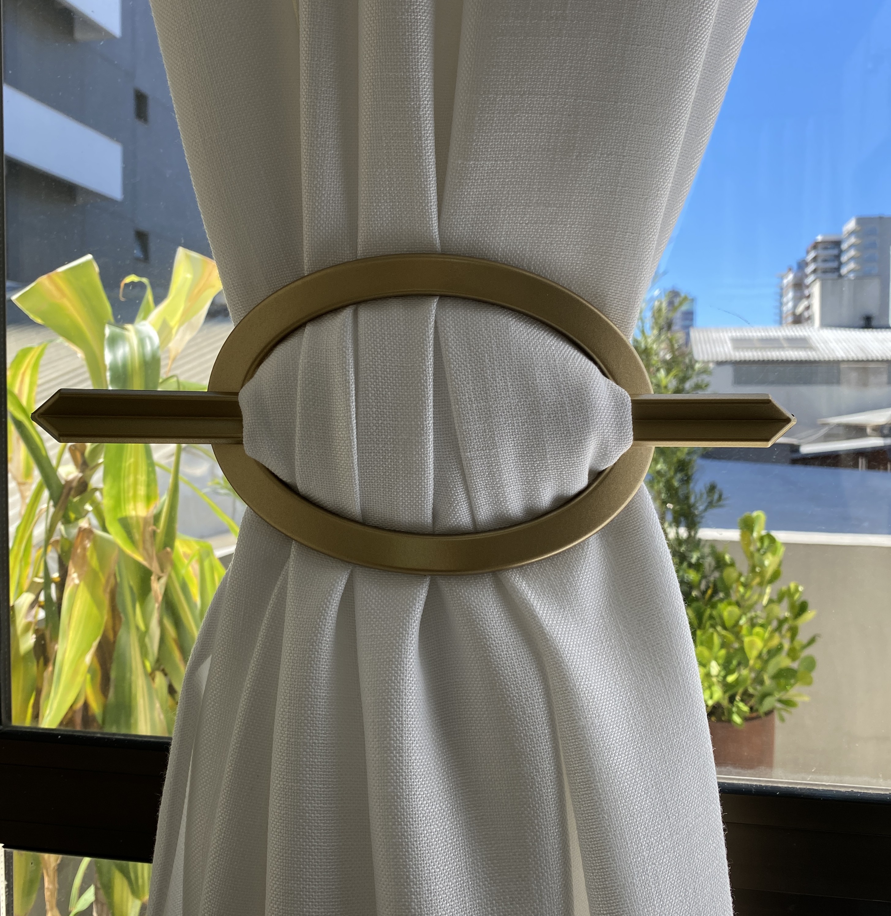 APANHADOR  DE CORTINA PLÁSTICO